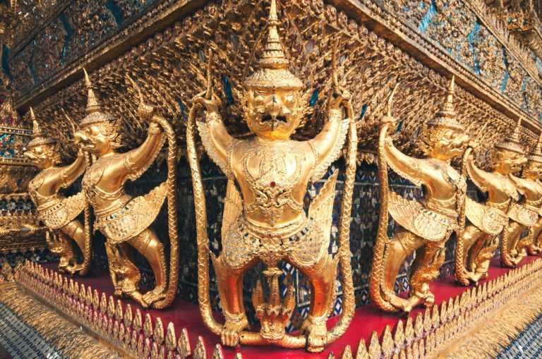 Ancient Asian temple carvings depicting mythological creatures