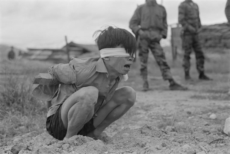 A Viet Cong prisoner awaits interrogation at the A-109 Special Forces Detachment in Thuong